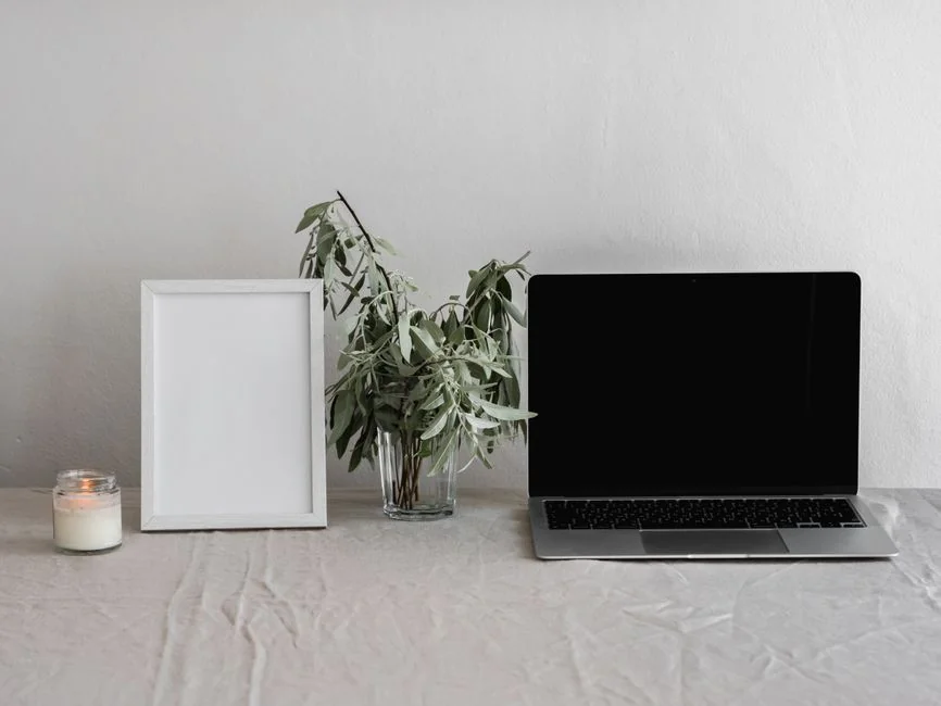 A contemporary workspace showcasing a laptop, tablet, and smartphones, ideal for tech and freelance use.